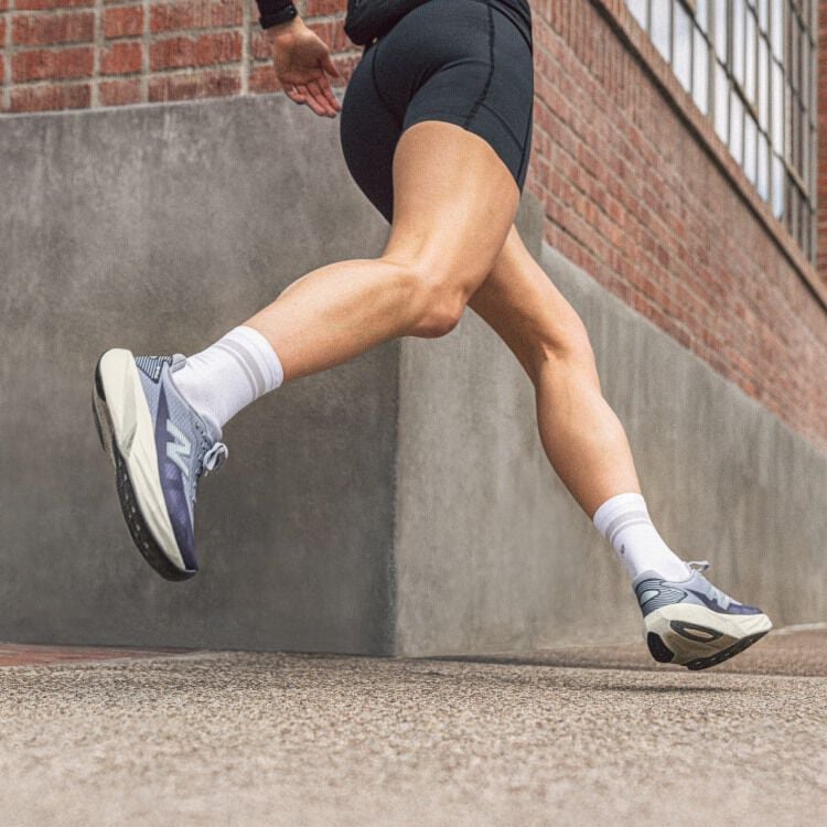 Knee down action shot of woman running